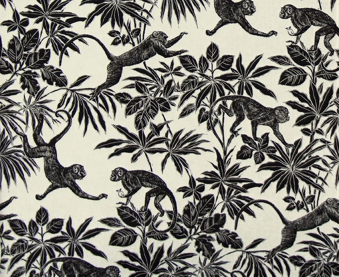 Monkeys leaping through black and white foliage